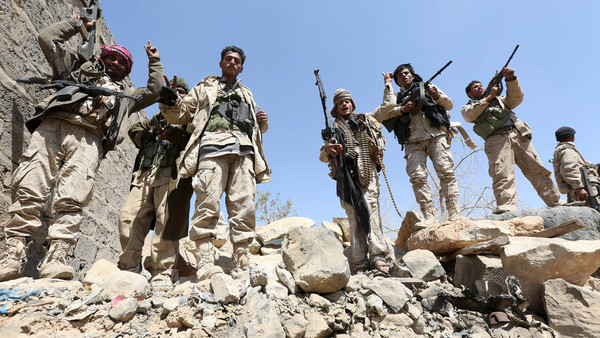 Pro-government army soldiers stand at the strategic Fardhat Nahm military camp, around 60km (40 miles) from Yemen’s capital Sanaa