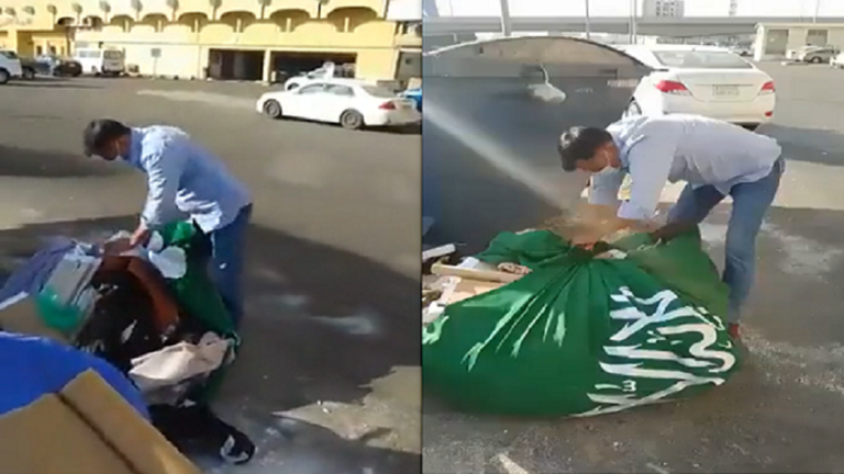 في مكة المكرمة..العلم السعودي تلف به الزبالة ويرمى في القمامة