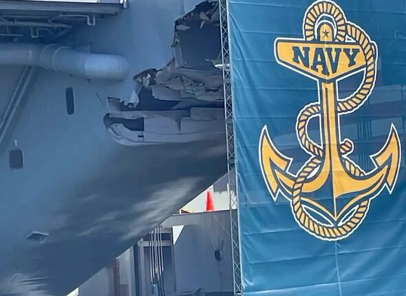 البحرية الأمريكية تحاول إخفاء أضرار لحقت بحاملة الطائرات ( ترومان) بملصقات أثناء خطاب لترامب
